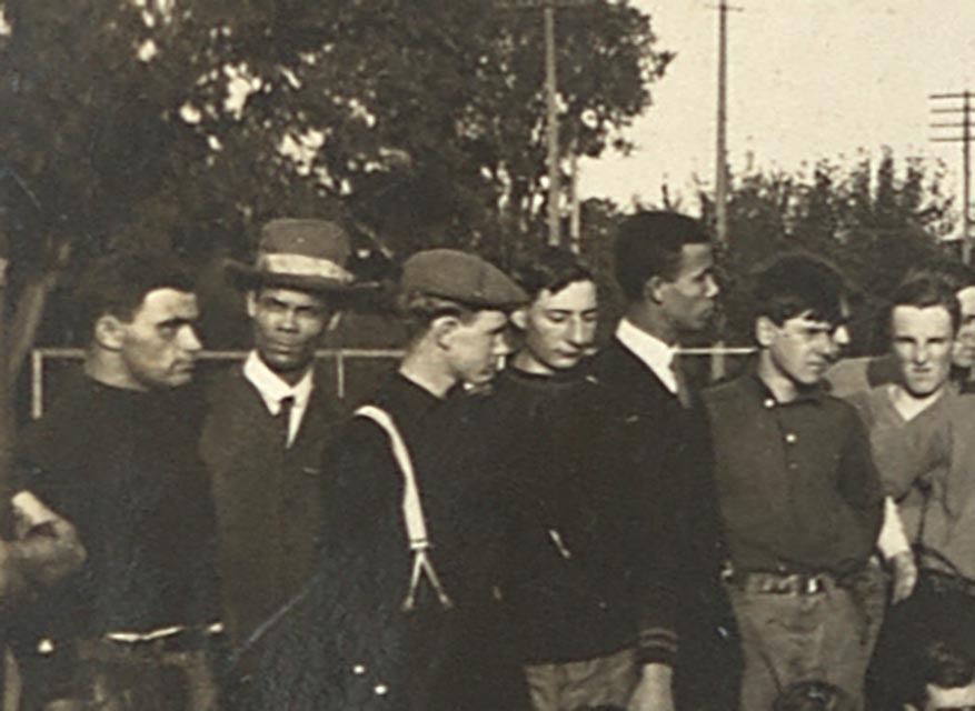 Solomon and John Williamson stand with participants and spectators of the annual pushball contest.