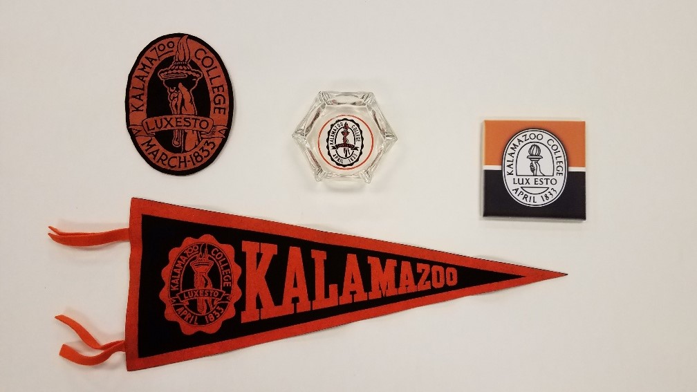 Kalamazoo College patch, pennant, ashtray, and coaster with the college logo.